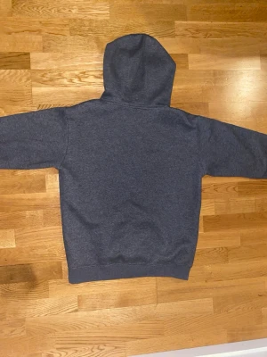 CK Hoodie  - Stay effortlessly stylish and comfortable with this iconic Calvin Klein hoodie. Crafted from soft, high quality cotton blend fabric, it offers a cozy fit perfect for everyday wear. Featuring a classic drawstring hood, ribbed cuffs, and a front kangaroo pocket, it combines practicality with timeless design. The minimalist CK logo on the chest adds a touch of understated elegance, making it versatile enough to pair with jeans, joggers, or layered under jackets. Ideal for casual outings, lounging, 