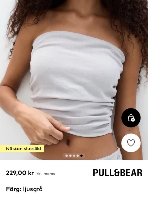 Ljusgrå bandeau tubtopp Pacific Republic - Snygg ljusgrå bandeau tubtopp från Pacific Republic. 