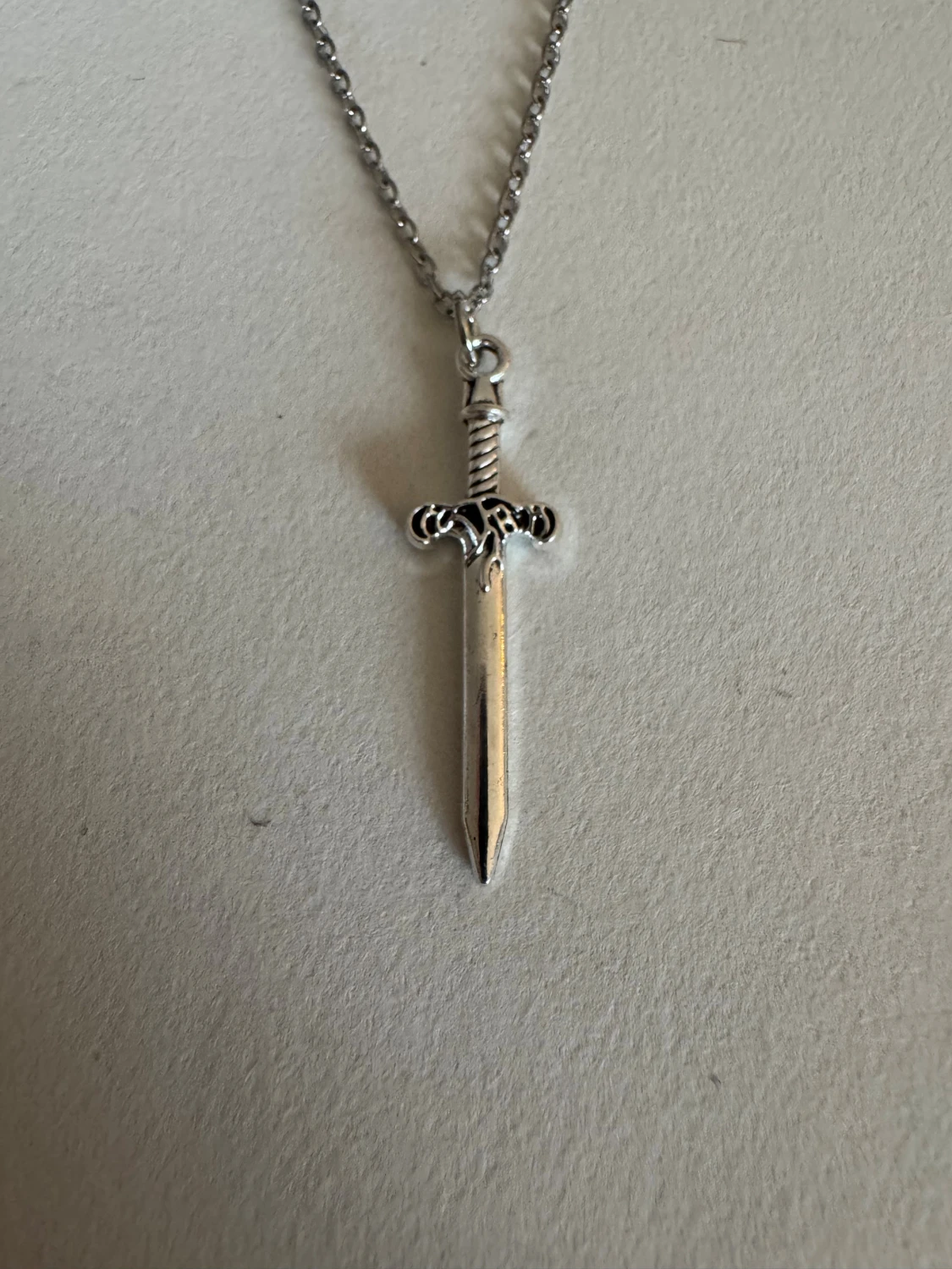 Silverhalsband mindre svärd