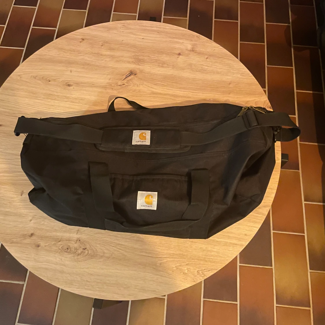 Svart duffelväska från Carhartt