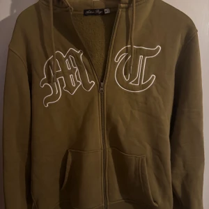 Tuttolente zip up tröja - Grön zip up från tuttolente. 