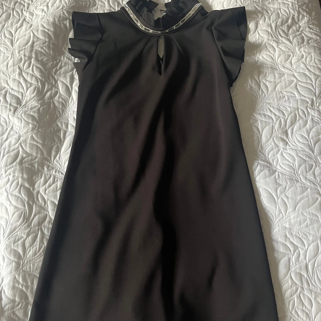 Svart kort klänning