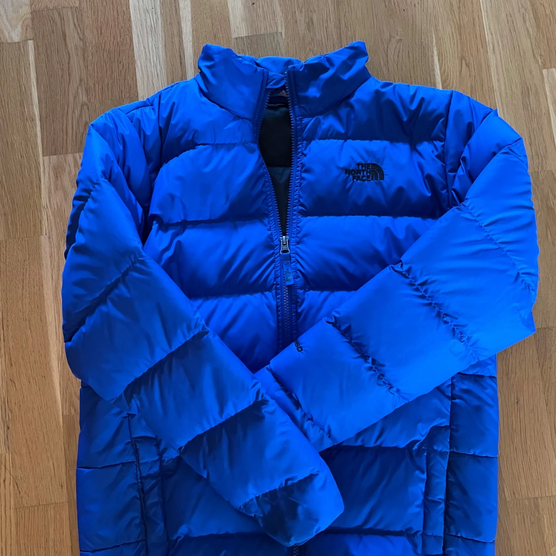 Blå pufferjacka från The North Face - 1