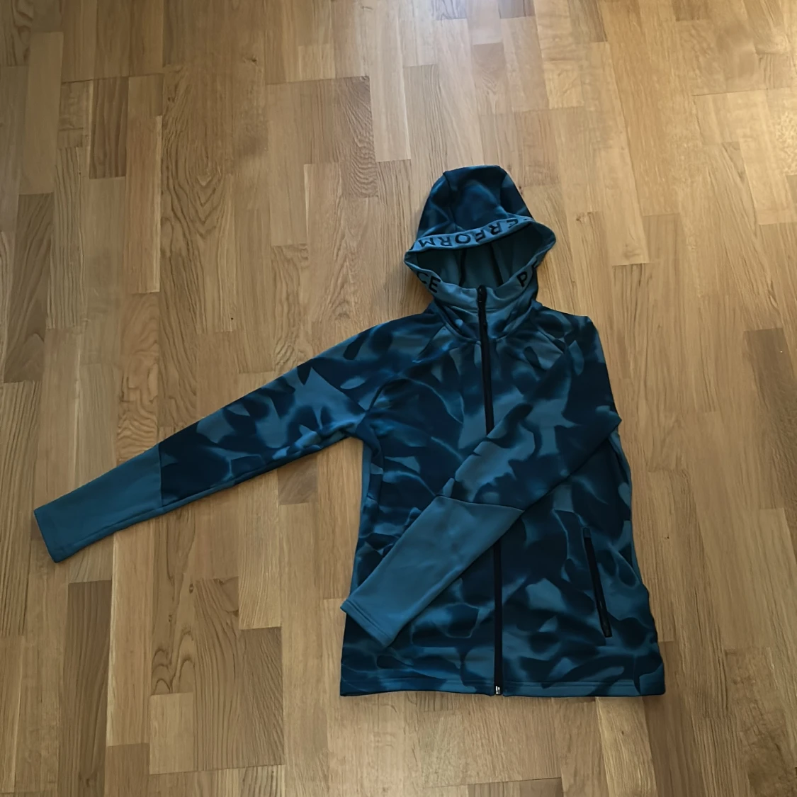Turkos blå jogg zip Hoodie ifrån peak performance