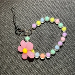 Blomma Nyckelring/Mobildekoration - helt ny & oanvänd.