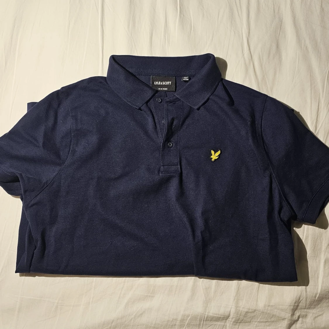 Marinblå pikétröja från Lyle & Scott - 1