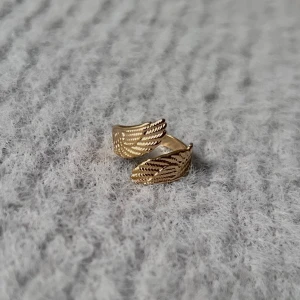 Golden Wings - Justerbar. Rostfri