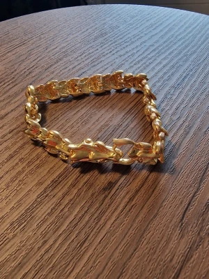 Armband drake - Armband drake "guld". Längd 20 cm.