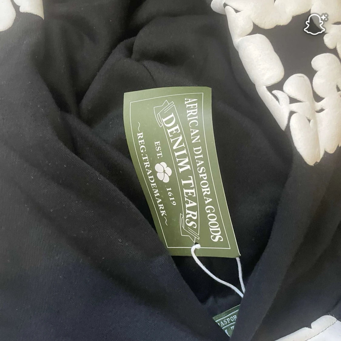 Svart hoodie från Denim Tears med blommor - 1