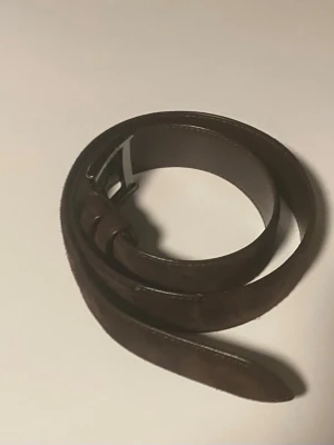 Mocka bälte  - Stilrent mocka bälte med brun färg, som har använts ca tio gånger