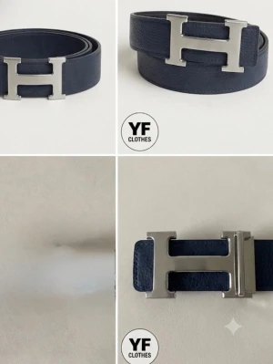Mörkblått bälte med H-spänne - Snyggt mörkblått bälte i läder med ett stort, silverfärgat H-format metallspänne. Bältet har en stilren och klassisk design som passar till många olika outfits. Perfekt accessoar för dig som vill ha en tidlös look.