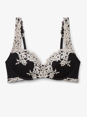 Intimissimi BH  - Snygg svart bh med vacker vit spets över kuporna och axelbanden. Bh:n har bygel och ger bra stöd, samtidigt som spetsen ger en lyxig och feminin känsla. Perfekt för dig som gillar eleganta underkläder med det lilla extra. Jag är lite osäker på storleken men skulle säga 75b/70c! Säljer på grund av att den är för stor  