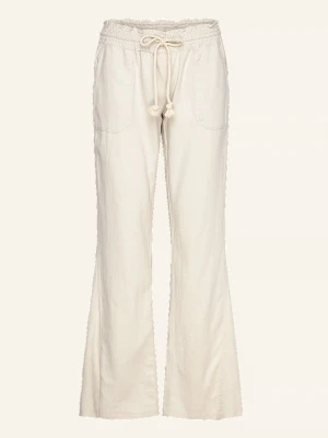 Roxy linnebyxor - Snygga vida linnebyxor i beige med resårmidja och dragsko. Byxorna har fickor fram och bak samt avslappnad passform. Perfekta för en chill och stilren look. Tillverkade i lätt och luftigt linnematerial. 