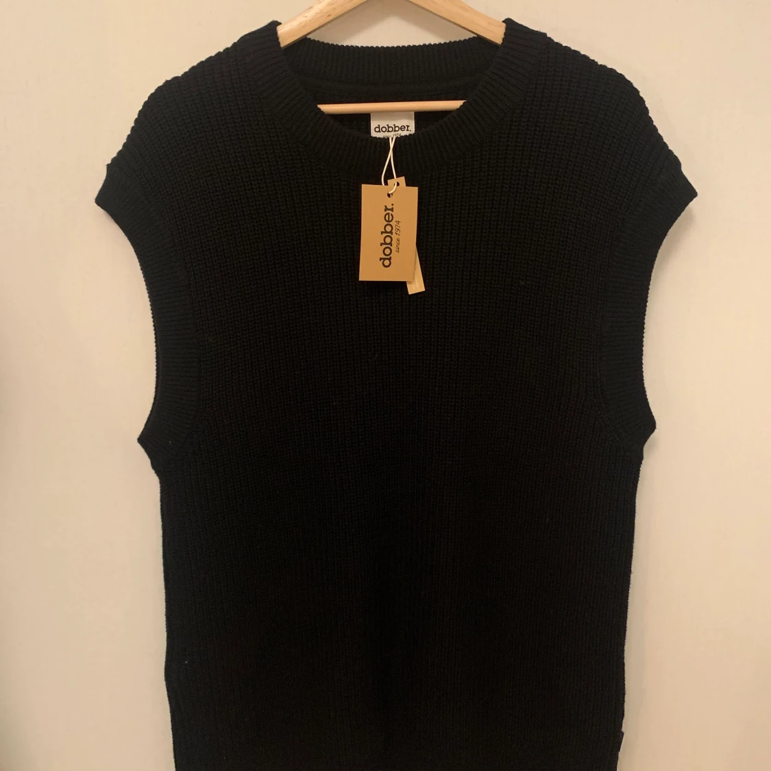 Oanvänd stickad väst 