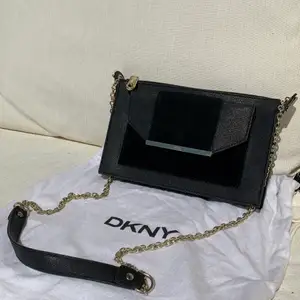 Excellent condition DKNY purse with gold chain, mixed velvet and leather material. 