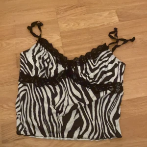 Zebra top som nt används - Spännband som man kan välja storlek på, storlek xs/ s