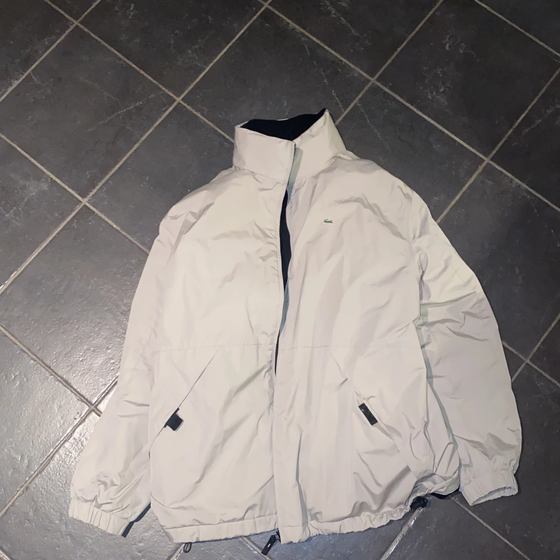 Beje Lacoste jacka