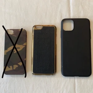 Iphoneskal - Jag säljer 3 olika skal, militär skalet är till iphone 5, det svarta med guldram runt är till iphone 6 och det svarta är till iphone 11 pro, Militärskalet är knappt använd, det svarta med guldram har jag använder runt 6 gånger och det helsvarta är oanvändt då det var fel storlek