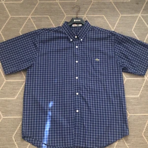 Lacoste piké  - Fin kortarmad Lacoste piké   Storlek: XL