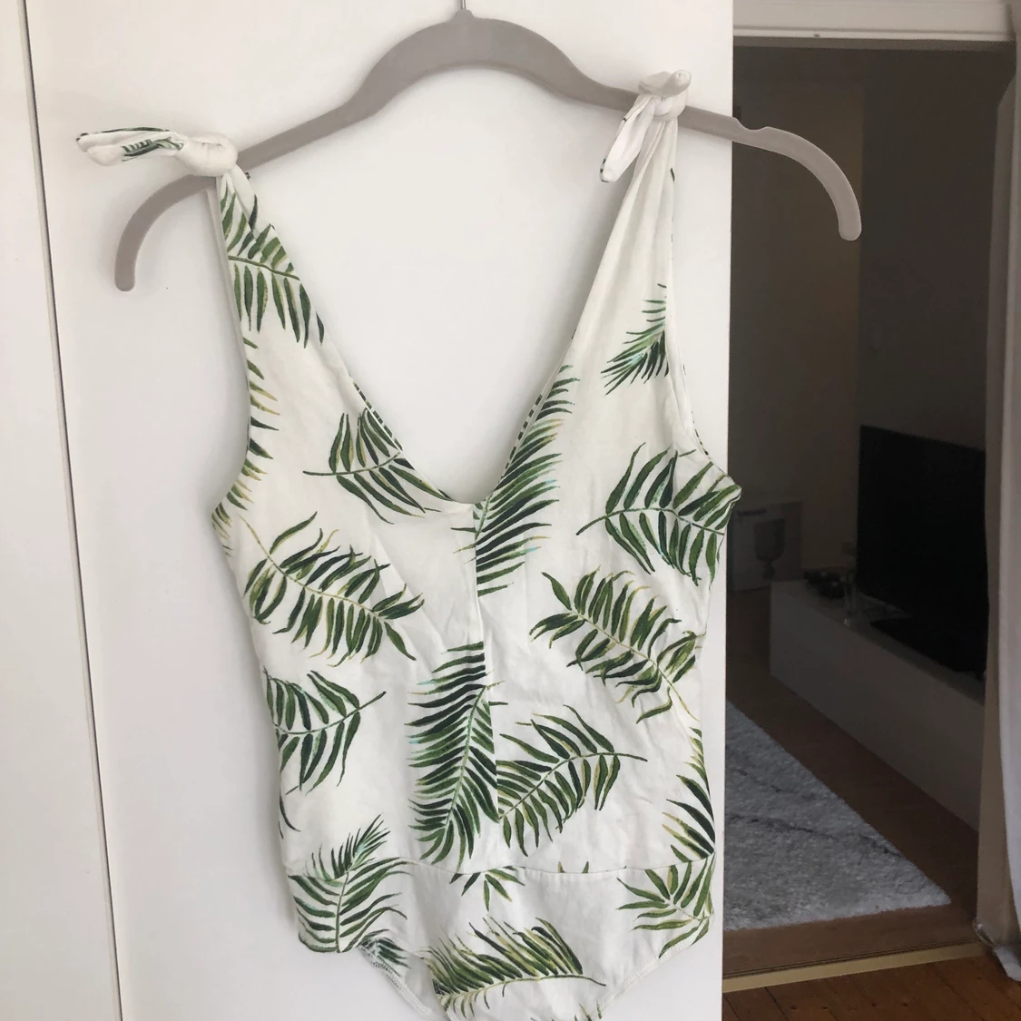 Mönstrad body från HM storlek XS - 90