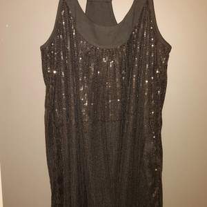 Brand new tunic / mini dress. Never worn, *without* tags - fully wearable production sample for quality representation! Clean, no defects.  Black dense sequins on the entire front and back. Double layered.  Fabric: no fabric tag available, but it's a cotton/viscose blend.   Size: M/L (it's a loose fit).