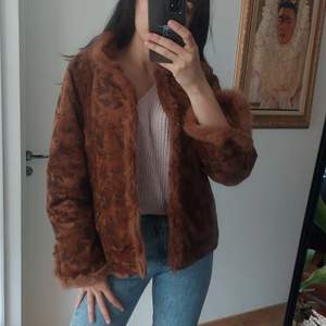 Vintage jacket with natural fur. Its in mint condition, not a single scratch or stain. 