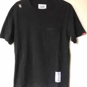 Neighborhood / NBHD x Common Sense Pocket T-Shirt  Size tag large, but fits like a men’s medium / small tee.  Great condition, no flaws or damage.  DM if you need exact size measurements.   Buyer pays for all shipping costs. All items sent with tracking number.   No swaps, no trades, no offers. 