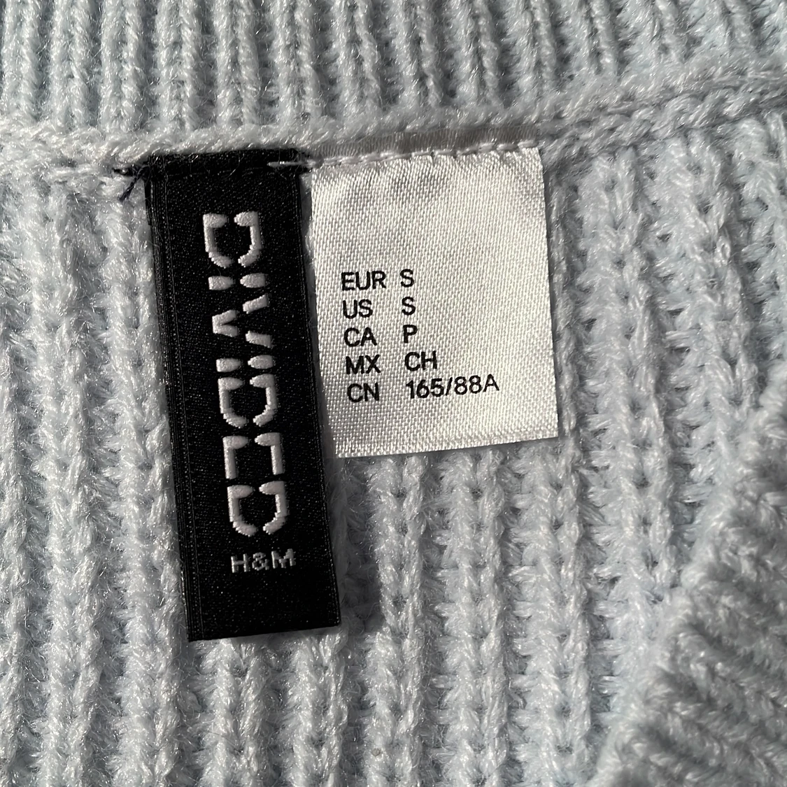 Ljusblå stickad väst - 91