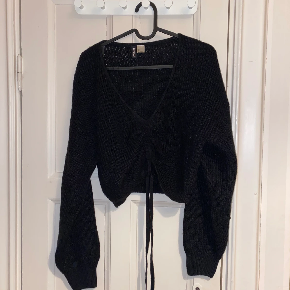 Svart stickad tröja