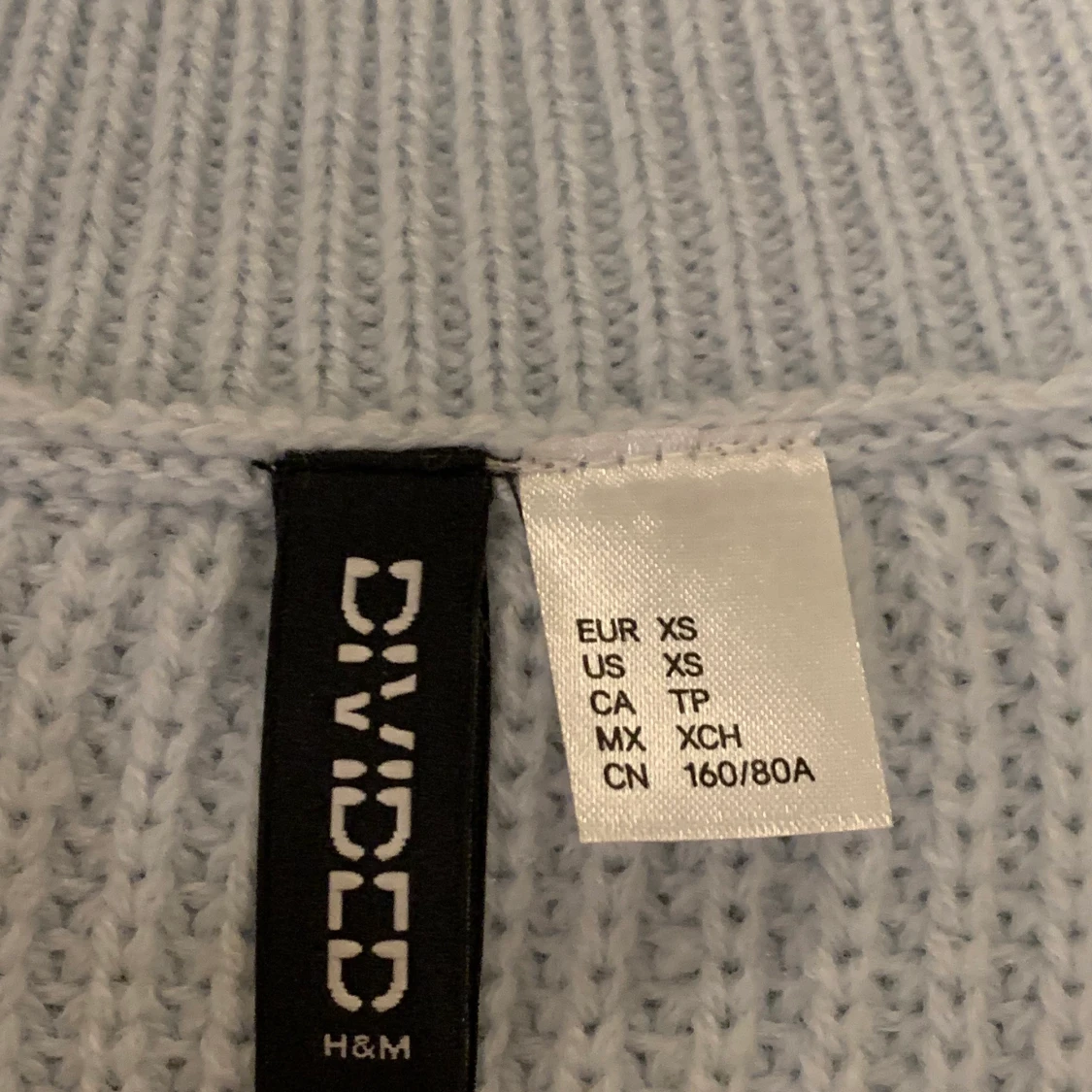 Blå stickad väst - 90