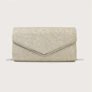 guldig clutch - frakt ingår i pris! guldfärgad glittrig clutch, aldrig använd. 