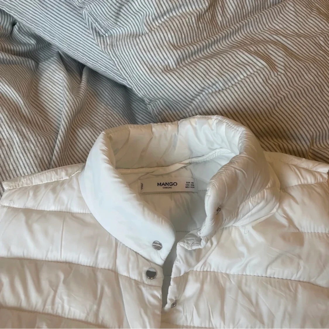 Vit dunväst mango  - 91