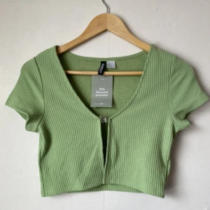 Divided H&M, open chested crop top in green, with butterfly detail  - New, unworn, perfect condition 