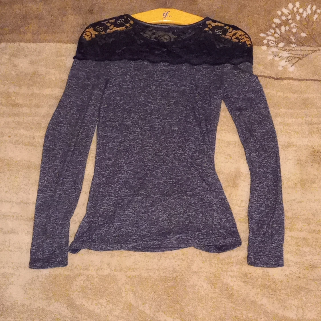 black blouse with lace on the back and front of the blouse.