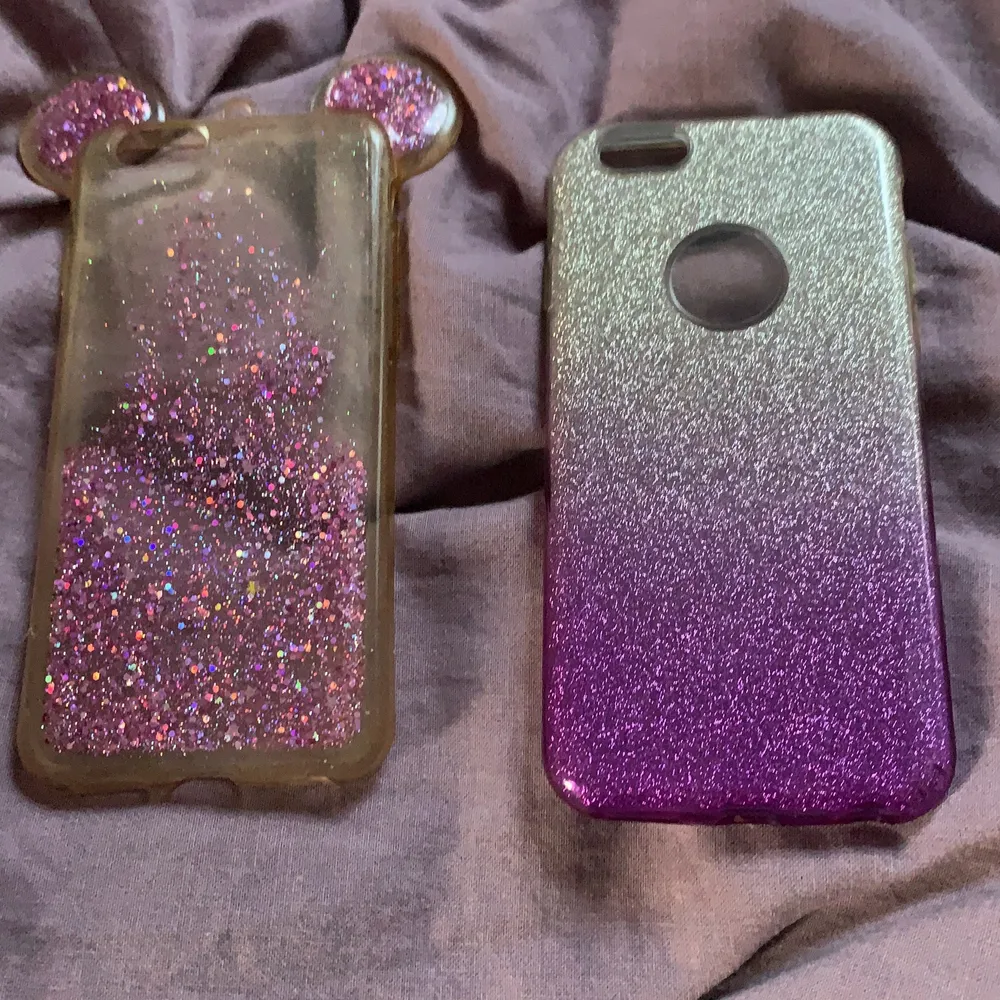 Två mobilskal som man kan ha till iPhone 5 och 6. Kanske till och med 7:an Riktigt fina och söta skal. Rekommenderas till små barn som gillar glitter och färger🤩 Finna inga hål eller sprickor, fina och fräscha. Lila och Rosa färger.. Accessoarer.