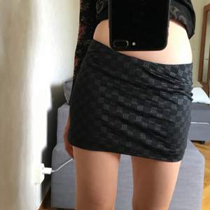 Misbhv monogram mini skirt in black. Never worn perfect condition. Fits sizes xs/s/m.