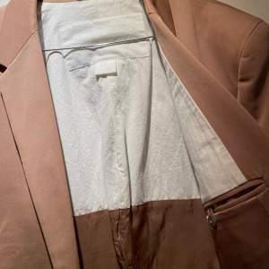 Suit jacket from Maison Martin Margiela & H&M collection.  Size: EUR 54 (Medium)  100% Wool