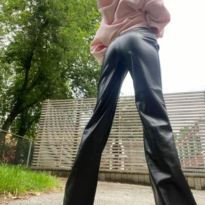 pleather pants 💅🏻 - sexy pleather pants, subtle bell-bottom, high-waisted and they make ur ass look bomb 💣 unused, size 32 but id say it fits more like a 34. the buyer pays for shipping, however, if u buy multiple items I can either offer u a discount or cover the shipping myself :)