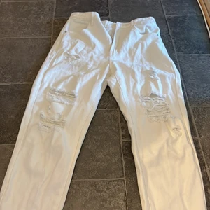 Vita slitna jeans - Storlej S