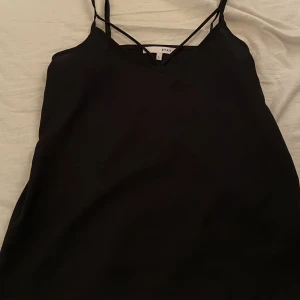 Svart linne/blus - Svart linne från carlnings 