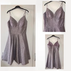 Klänning - Glittrig festklänning , använt 1 gång , storlek 34-36 . Den är i nyskick . 