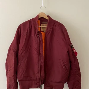 Alpha Industries Bomber Jacket - Classic Bomber, burgundy color.