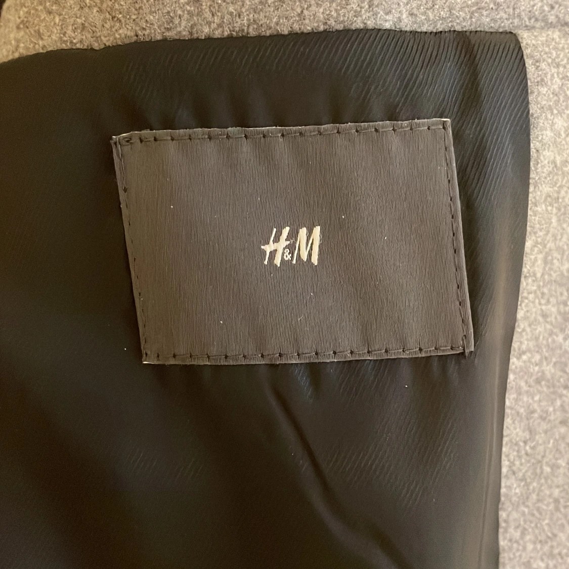 Grå kappa från HM - 91