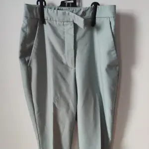 Sage green suit pants, worn just a few times. In very good shape.