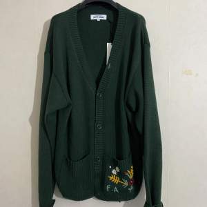 Fucking awesome cardigan XL  Sold out everywhere. Highly sought after piece only worn 2-4 times.  This oversized Fucking Awesome cardigan is knitted from a forest green wool blend. It has small square pockets, one of which is embroidered.