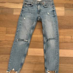 Never worn  Boyfriend jeans  Size xs Crop fit with tears on the knees 