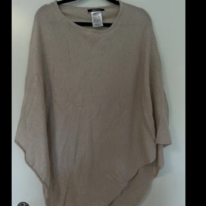 Stickad poncho - Mysig stickad poncho