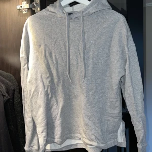 Huvtröja J Lindberg  - Ljusgrå hoodie från J Lindberg 