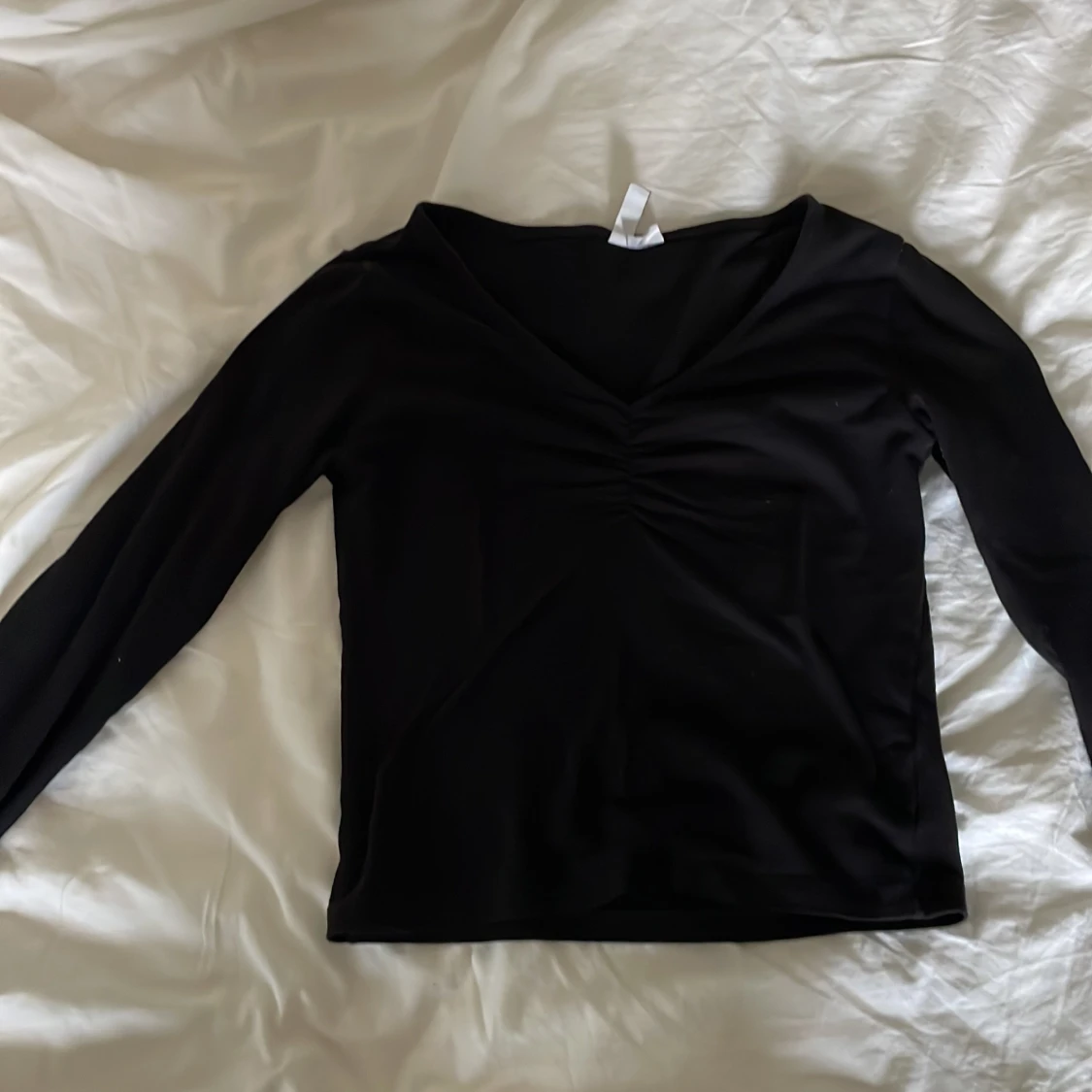 Långarmad tröja med detalj vid brösten  - 90