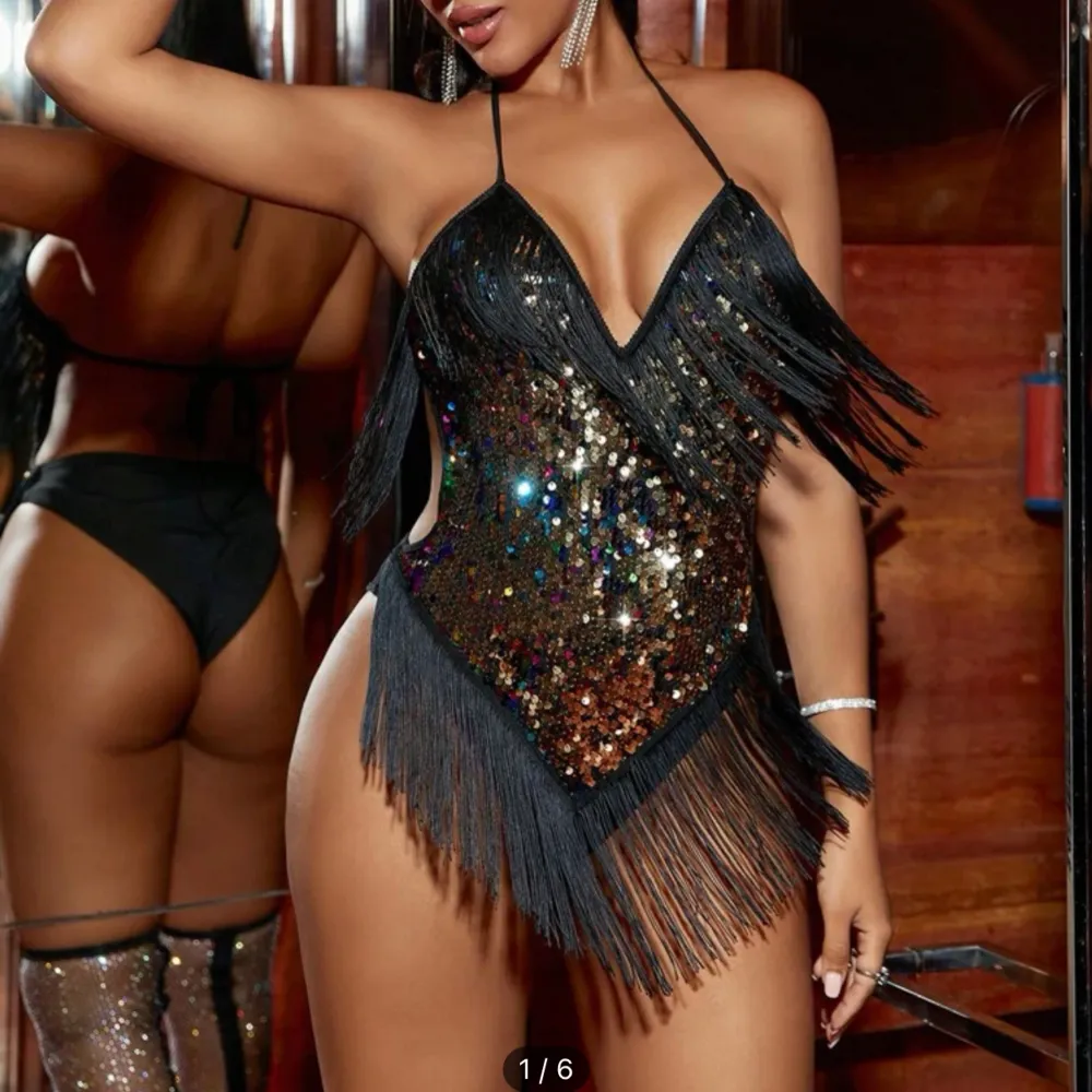 Brand new body suit with colourful sparkles and fringe detail. Great for parties . Toppar.